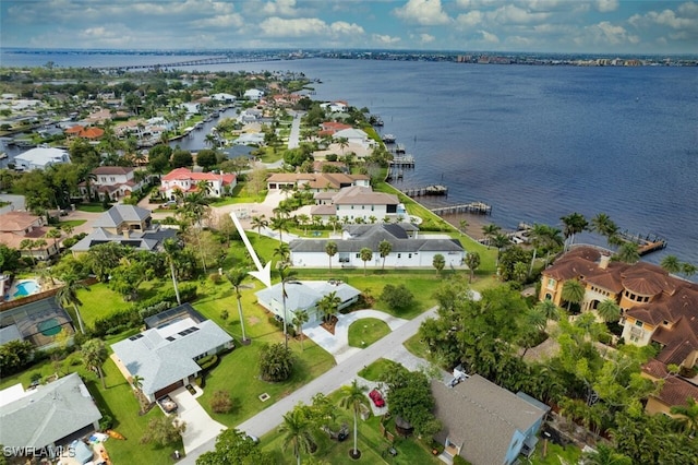 bird's eye view with a residential view and a water view