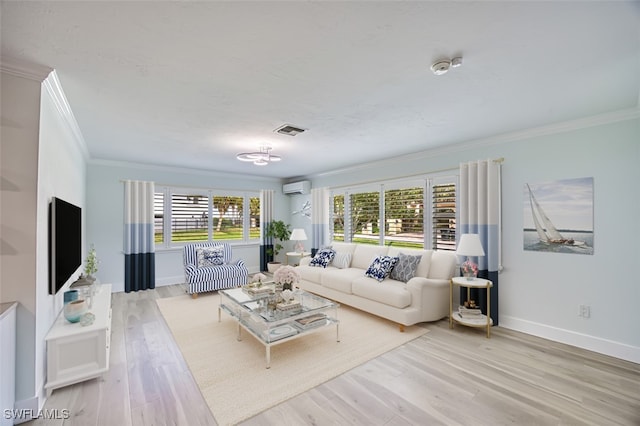 living area with visible vents, ornamental molding, wood finished floors, a wall mounted air conditioner, and baseboards