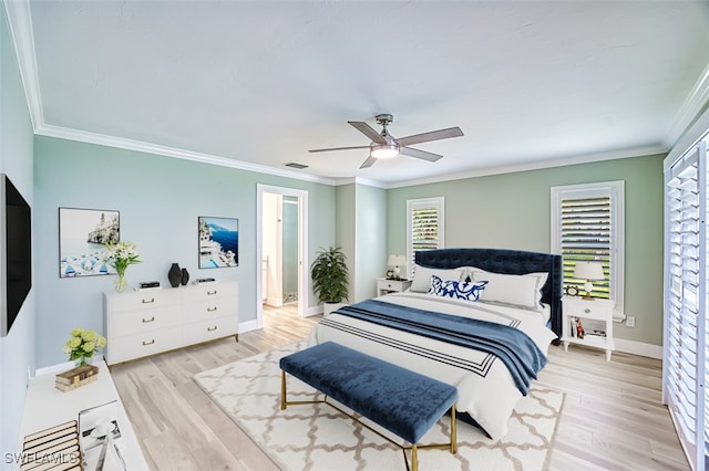 bedroom featuring visible vents, ornamental molding, ceiling fan, wood finished floors, and baseboards