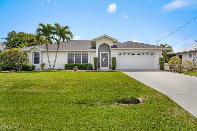 view of front of house featuring driveway, an attached garage, a front yard, and stucco siding