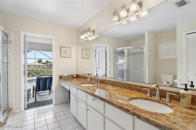 full bath with a stall shower, tile patterned flooring, a sink, and visible vents