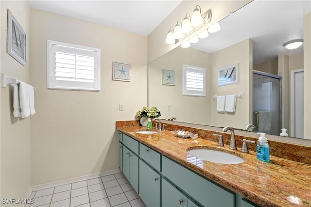 full bath with double vanity, tile patterned flooring, a sink, and a shower stall