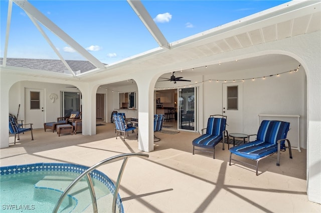 exterior space with a patio area, a lanai, and a ceiling fan