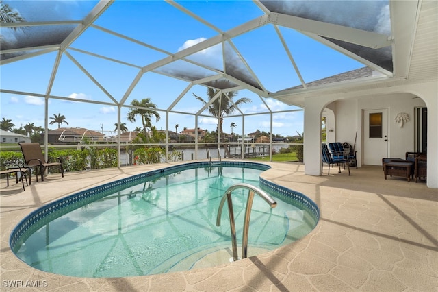 outdoor pool featuring a lanai and a patio