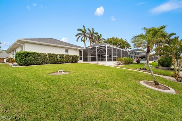 view of yard featuring glass enclosure