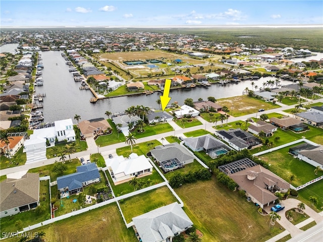 aerial view featuring a water view and a residential view