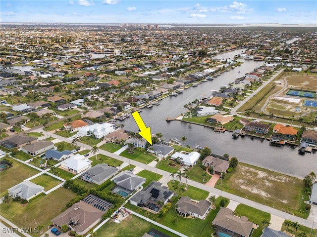 aerial view featuring a residential view and a water view