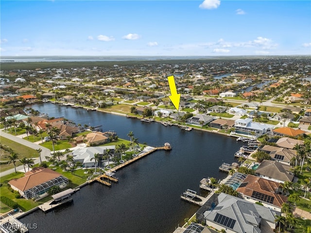 birds eye view of property featuring a residential view and a water view