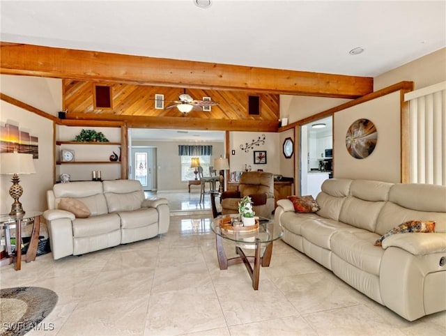 living room featuring vaulted ceiling with beams and a ceiling fan