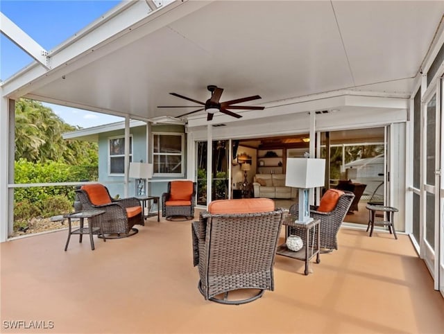 view of patio with a lanai and ceiling fan