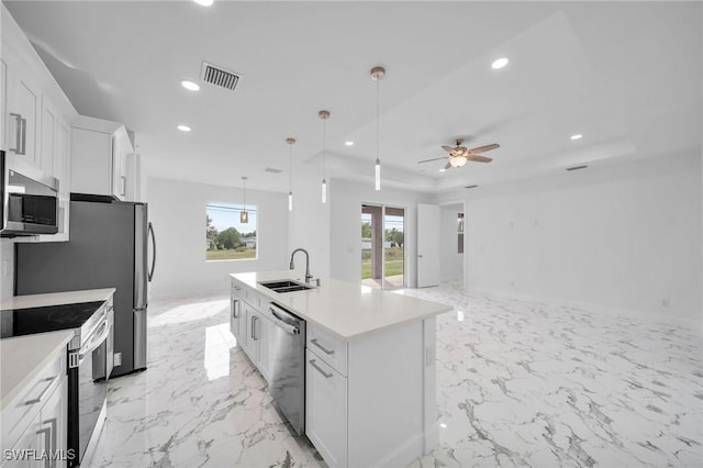 kitchen featuring stainless steel appliances, recessed lighting, visible vents, white cabinetry, and a sink