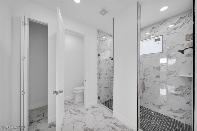 bathroom featuring toilet, marble finish floor, a marble finish shower, and baseboards