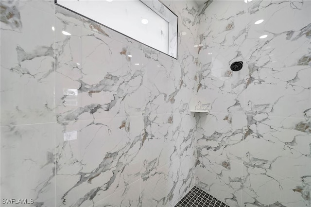 room details with a marble finish shower