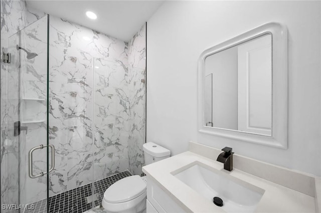 bathroom with toilet, recessed lighting, a marble finish shower, and vanity