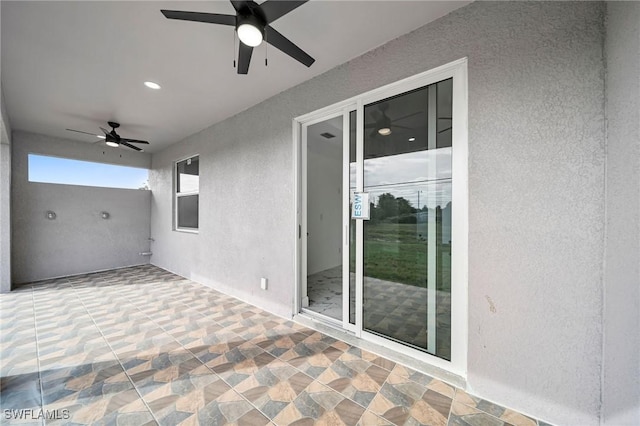 view of patio with ceiling fan