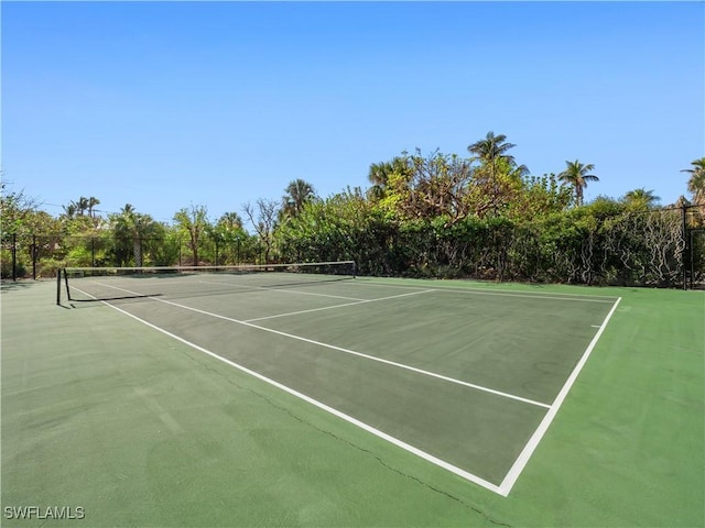 view of sport court with fence