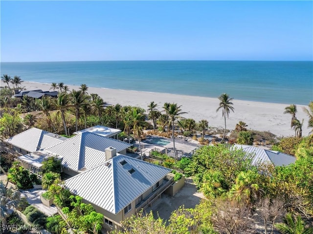 aerial view featuring a view of the beach and a water view