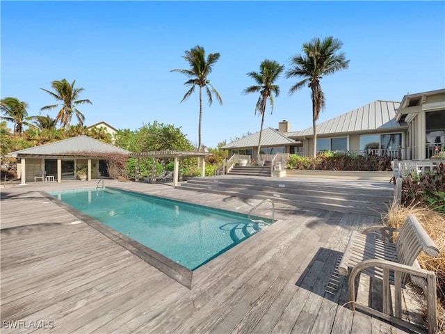 outdoor pool with a pergola and a gazebo