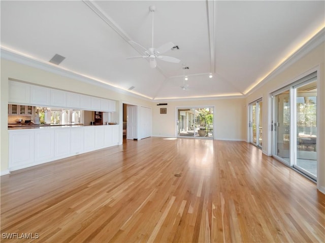 unfurnished living room with a ceiling fan, visible vents, high vaulted ceiling, and light wood-style flooring