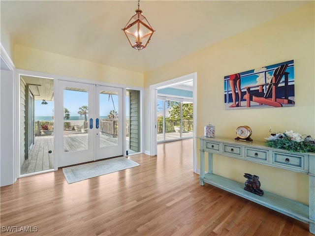 doorway to outside featuring wood finished floors and french doors