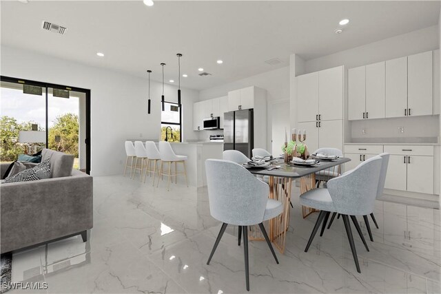 dining room featuring marble finish floor, visible vents, and recessed lighting