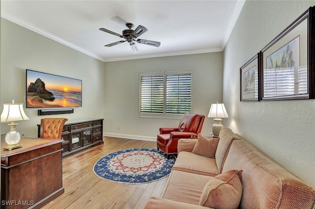 living room featuring baseboards, wood finished floors, ornamental molding, and a ceiling fan