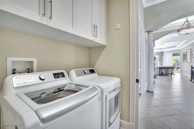 laundry room with independent washer and dryer, crown molding, light tile patterned floors, decorative columns, and baseboards