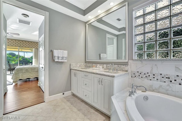 bathroom featuring visible vents, a garden tub, ensuite bathroom, tile patterned flooring, and vanity