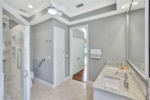 full bath featuring a sink, visible vents, ornamental molding, and a shower stall