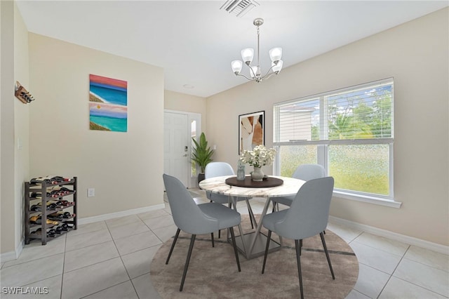 dining space featuring a chandelier, visible vents, baseboards, and light tile patterned flooring