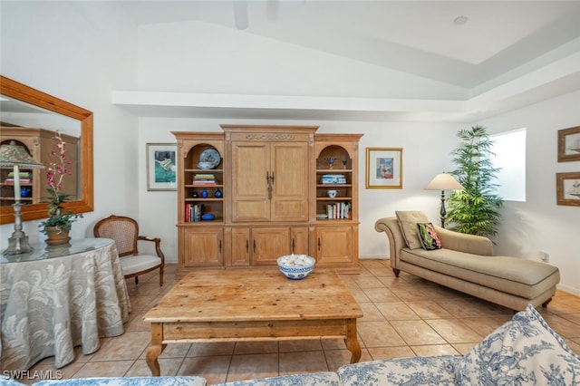 living area with vaulted ceiling and light tile patterned floors