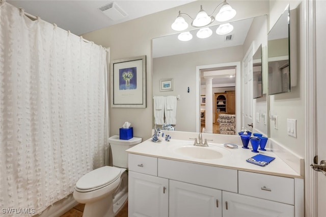 bathroom featuring visible vents, curtained shower, toilet, and vanity