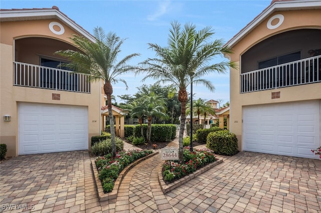 exterior space featuring decorative driveway