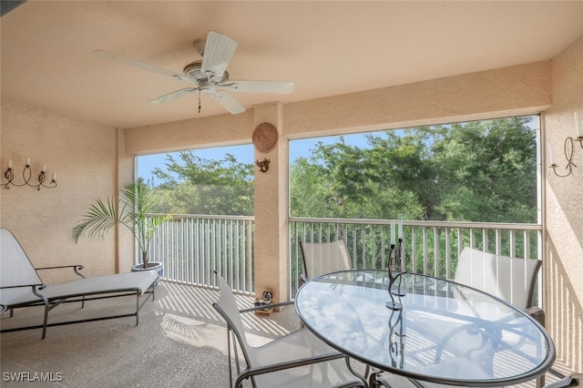 exterior space with outdoor dining space and a ceiling fan