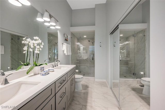 full bath with marble finish floor, toilet, and a sink