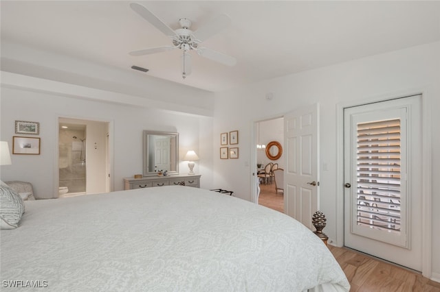 bedroom featuring connected bathroom, ceiling fan, and light wood finished floors