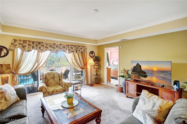 carpeted living room featuring ornamental molding and visible vents