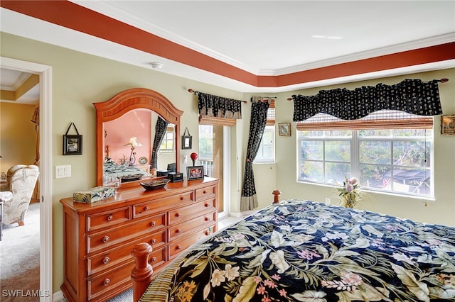 carpeted bedroom with ornamental molding