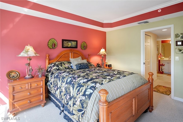 carpeted bedroom featuring visible vents, ornamental molding, and baseboards