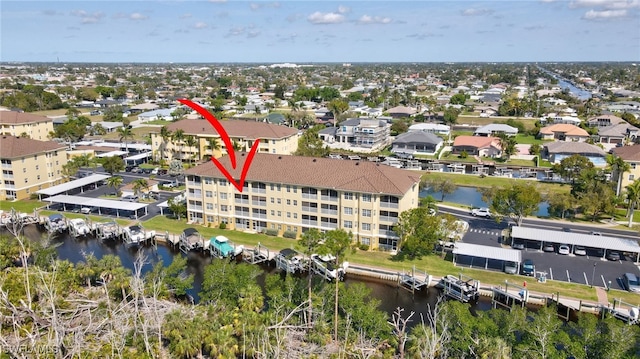 aerial view with a residential view and a water view