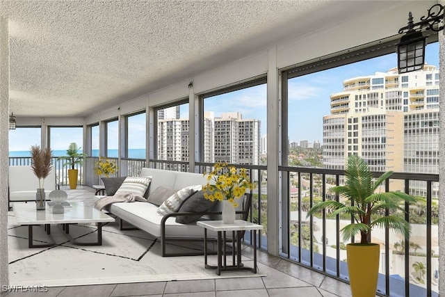 sunroom featuring a city view