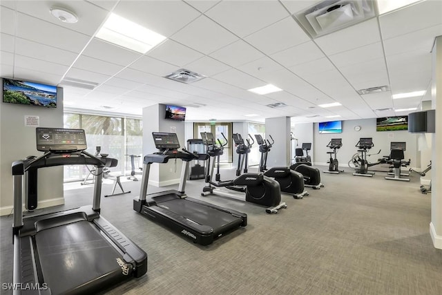 gym with visible vents, a paneled ceiling, baseboards, and carpet floors