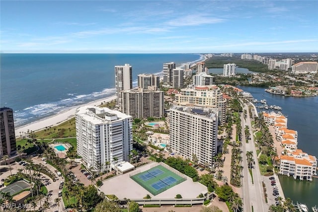 birds eye view of property with a view of city and a water view