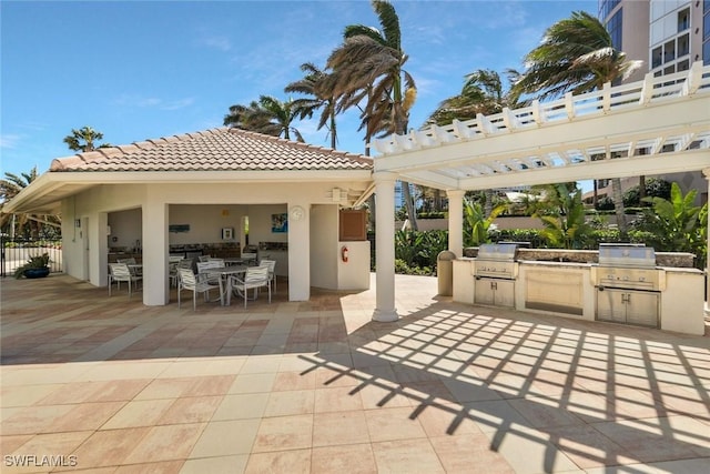 view of patio / terrace featuring area for grilling, outdoor dining space, grilling area, and fence