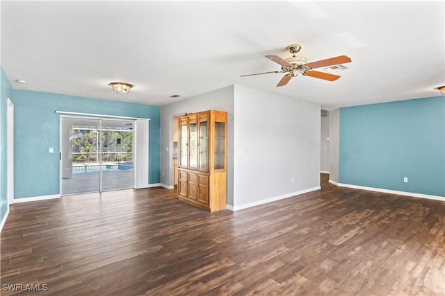 unfurnished living room with ceiling fan, dark wood-style flooring, visible vents, and baseboards