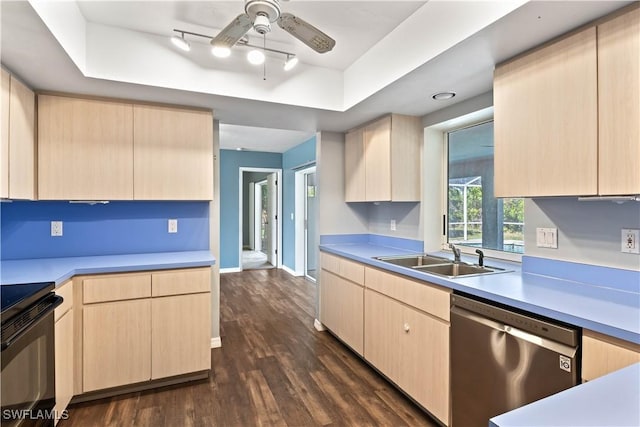 kitchen featuring electric range, a tray ceiling, stainless steel dishwasher, light brown cabinets, and a sink