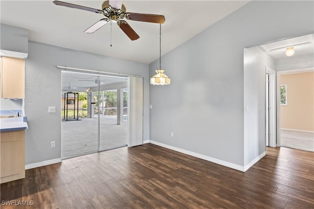 11253 Rabun Gap Dr, North Fort Myers, FL 33917 - spare room with a ceiling fan, dark wood finished floors, and baseboards