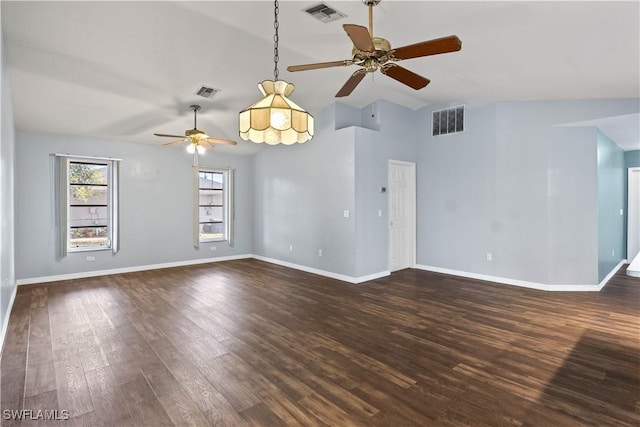 11253 Rabun Gap Dr, North Fort Myers, FL 33917 - unfurnished living room with ceiling fan, dark wood-type flooring, vaulted ceiling, and baseboards