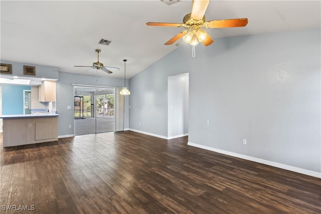 unfurnished living room with lofted ceiling, dark wood-type flooring, visible vents, baseboards, and a ceiling fan