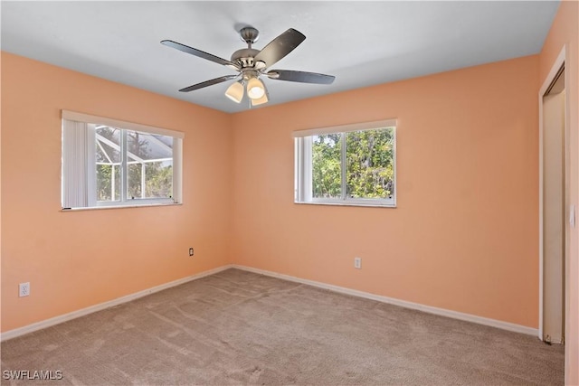 unfurnished bedroom with carpet flooring, ceiling fan, and baseboards